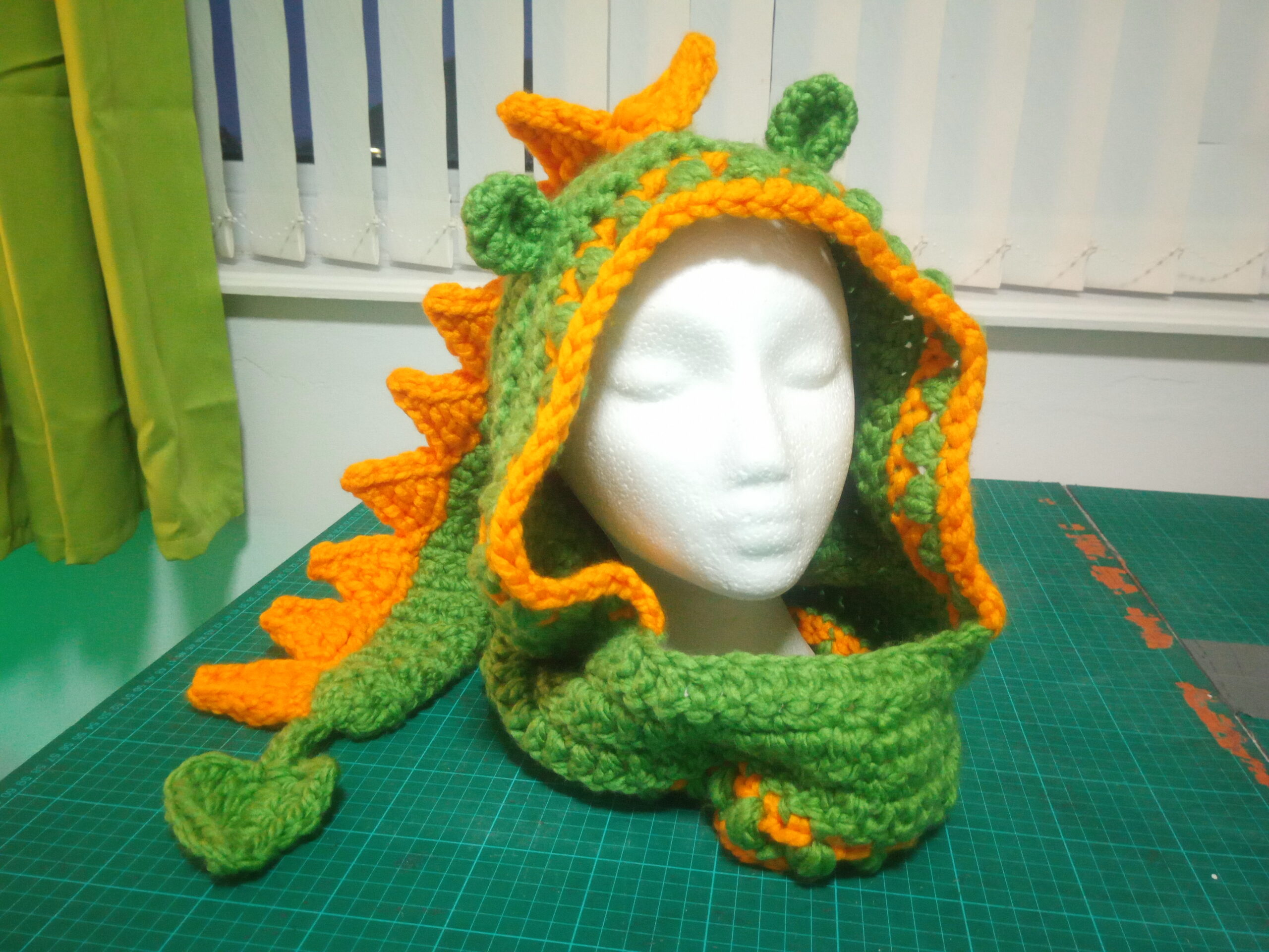 Green and yellow dragon hood