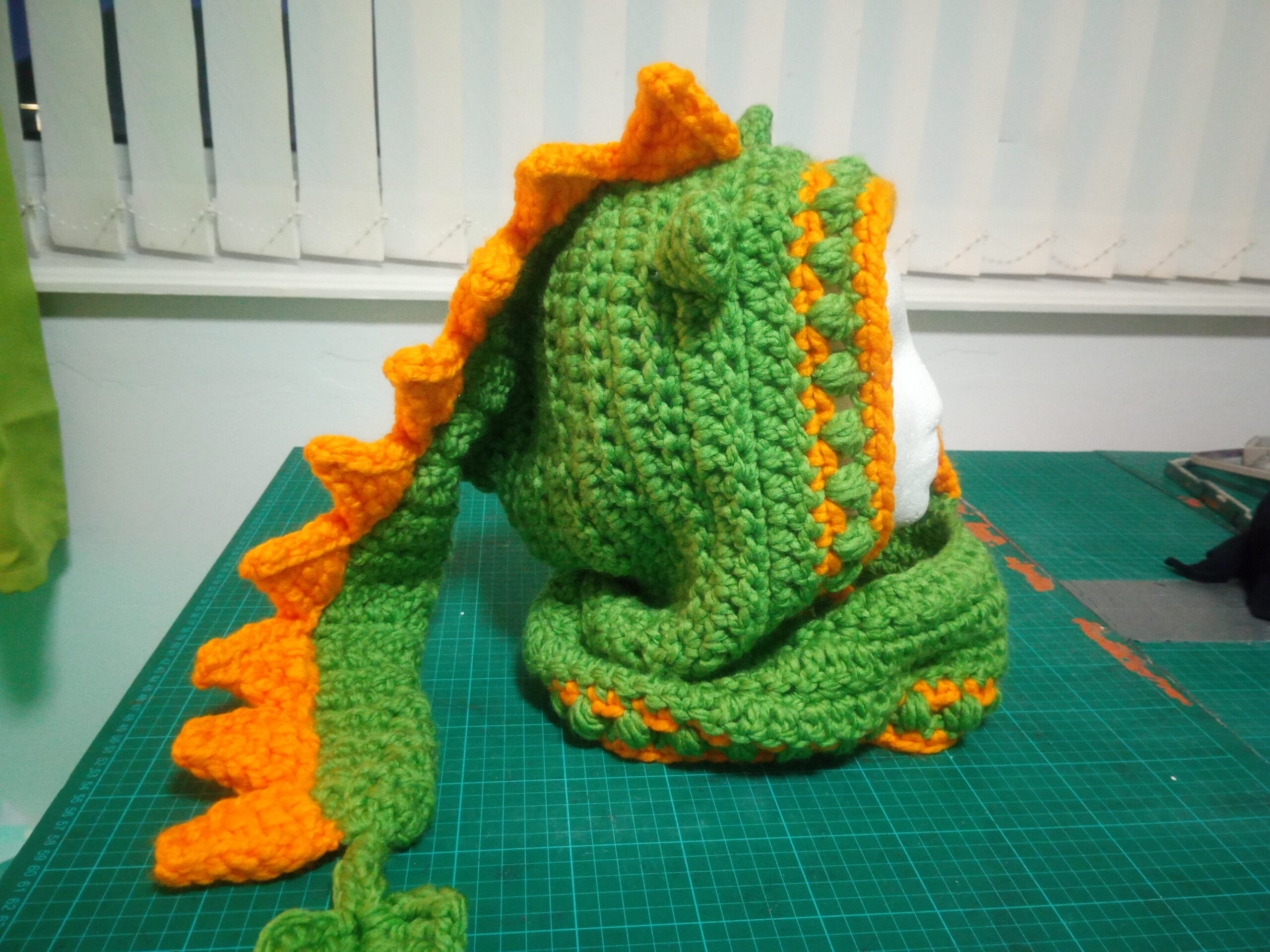 Green and yellow dragon hood